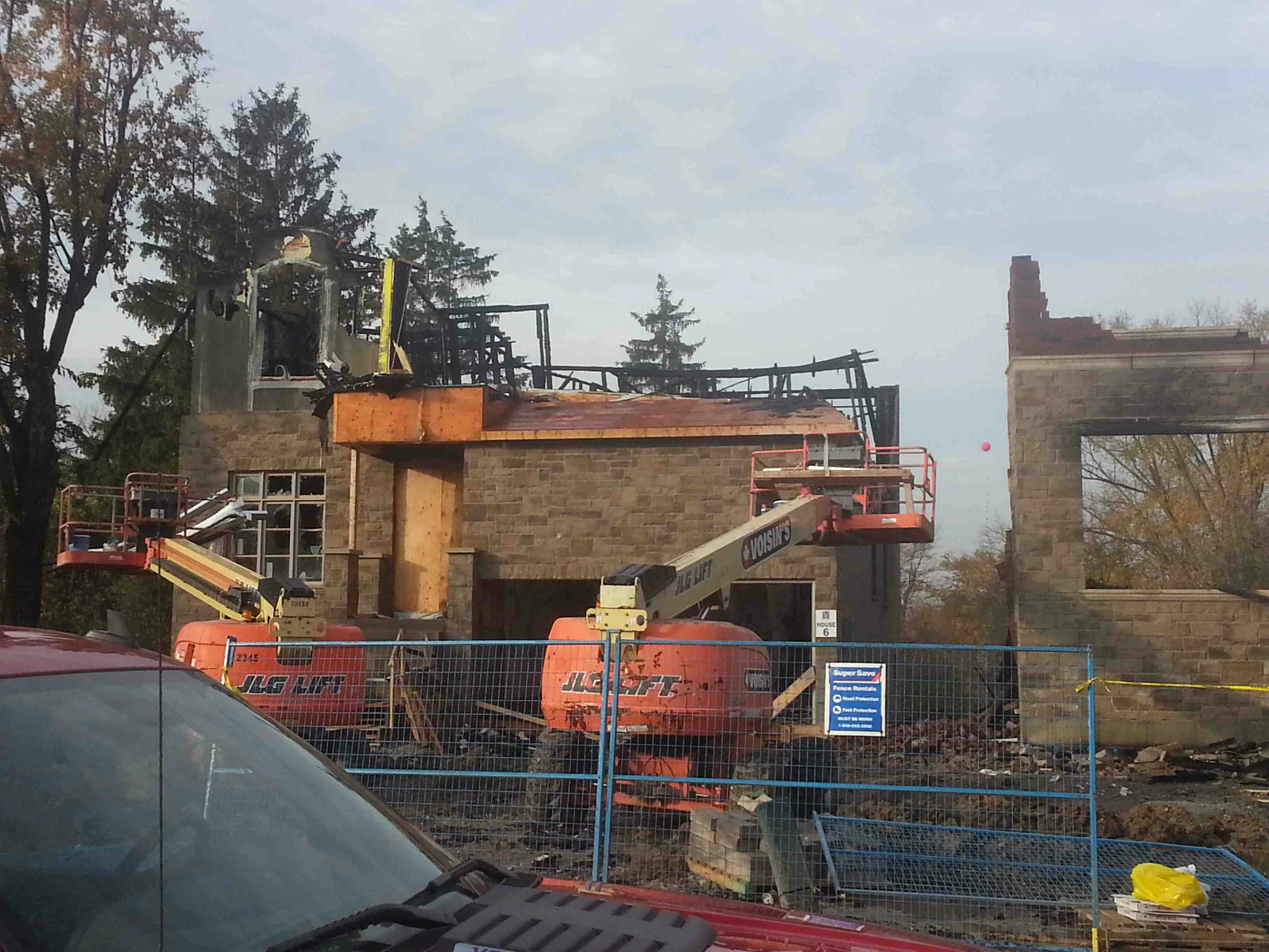 Fire-damage-to-building-with-two-excavators