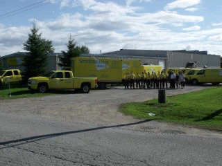ServiceMaster-of-Orillia-group-photo-in-front-of-their-trucks