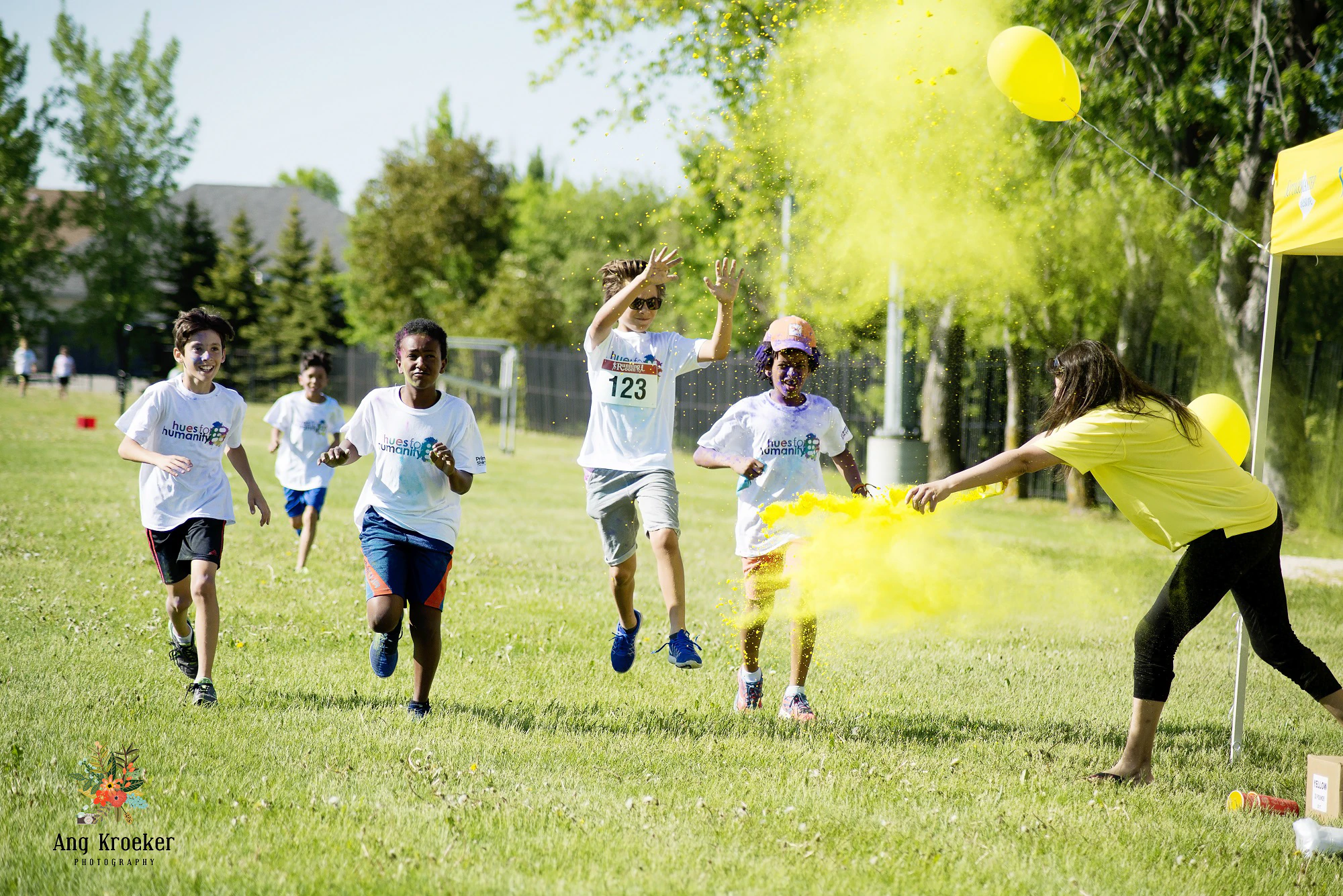 Children-running-with-yellow-powder-playfully-thrown-at-them