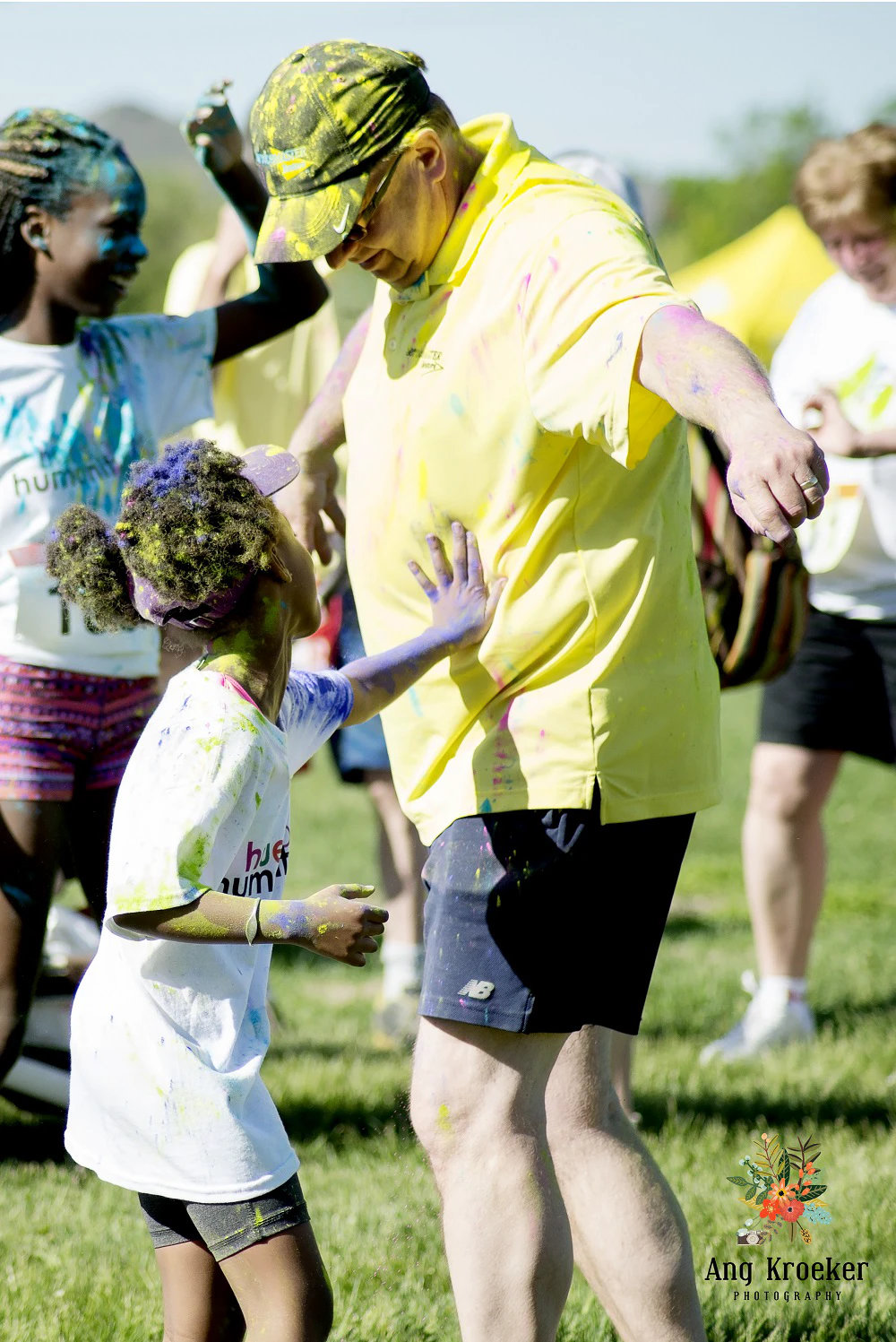 Individuals-covered-in-multicoloured-powder-at-event
